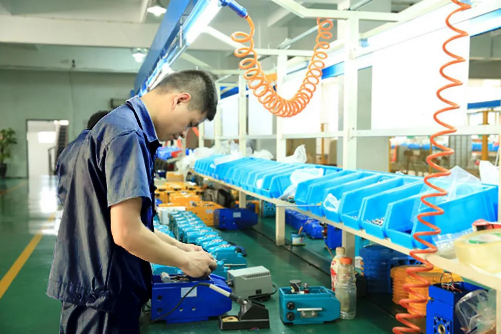 Operator assembling actuated valves on a DELCO production line