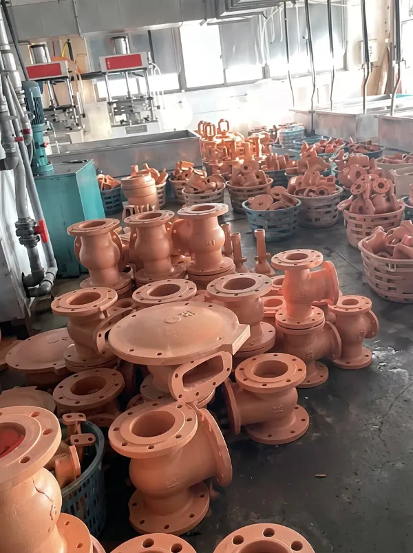 Freshly cast valve bodies in the wax-mould workshop
