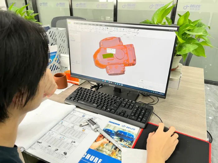 3D CAD model of a valve body on screen